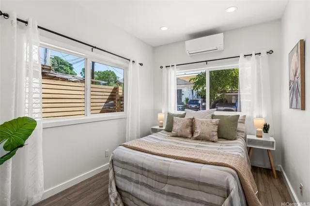 a bedroom with a large bed and a window
