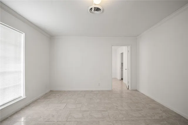 an empty room with a empty space and windows