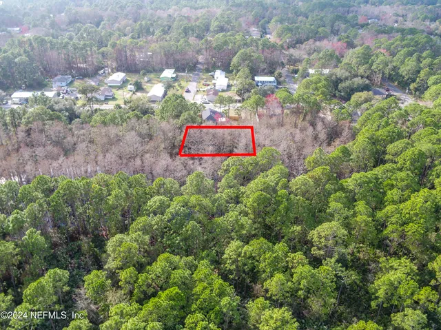 a view of a yard with a tree