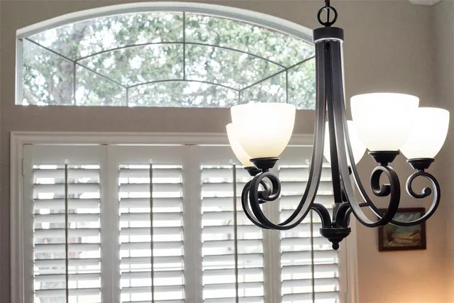 a bathroom with a toilet a sink and a window