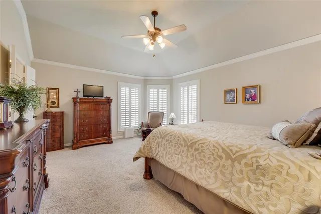 a bedroom with a bed and dresser