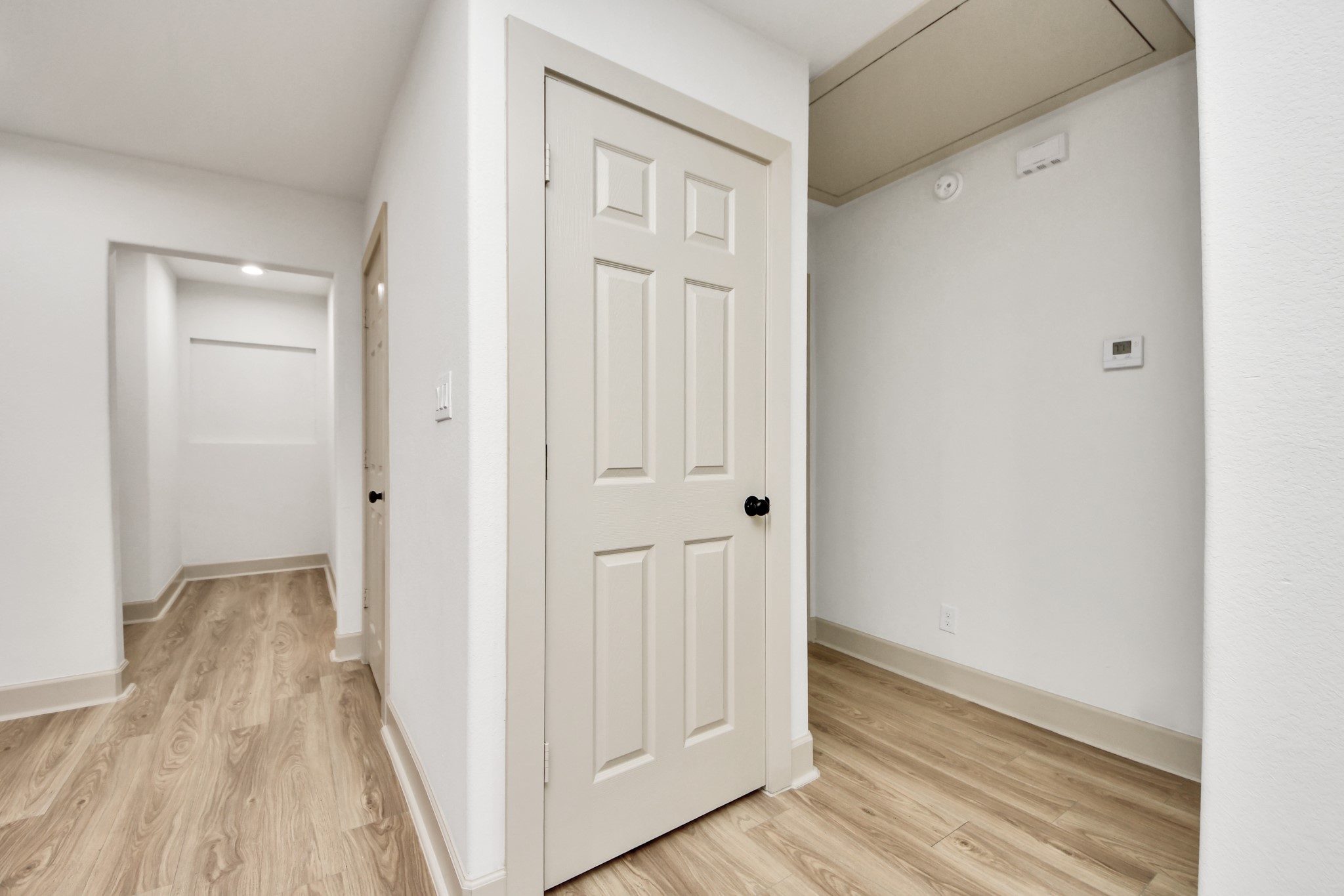 2919 Rosedale Street, Unit B Houston, TX 77004 - Photo 32 of 35 a view of a hallway with wooden floor