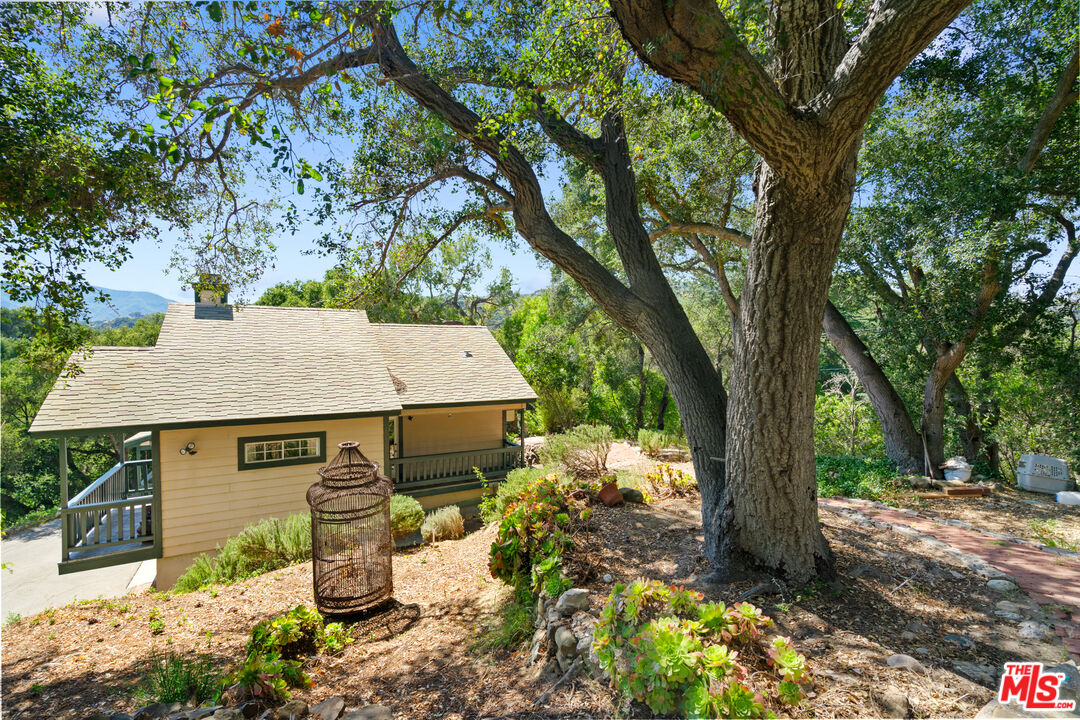 20912 Fontaine Road Topanga, CA 90290 - Photo 50 of 52 a view of a house with a tree and yard