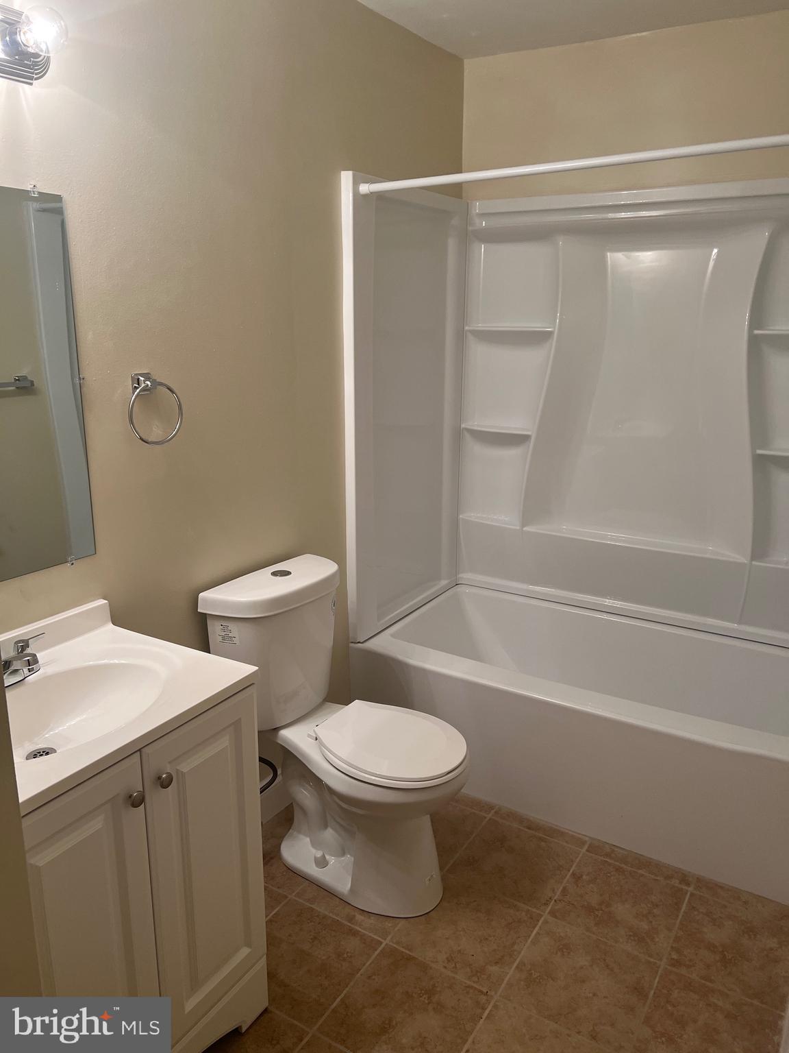 26 Hampton Gate Drive, Unit B Sicklerville, NJ 08081 - Photo 12 of 17 a white toilet sitting next to a bath tub