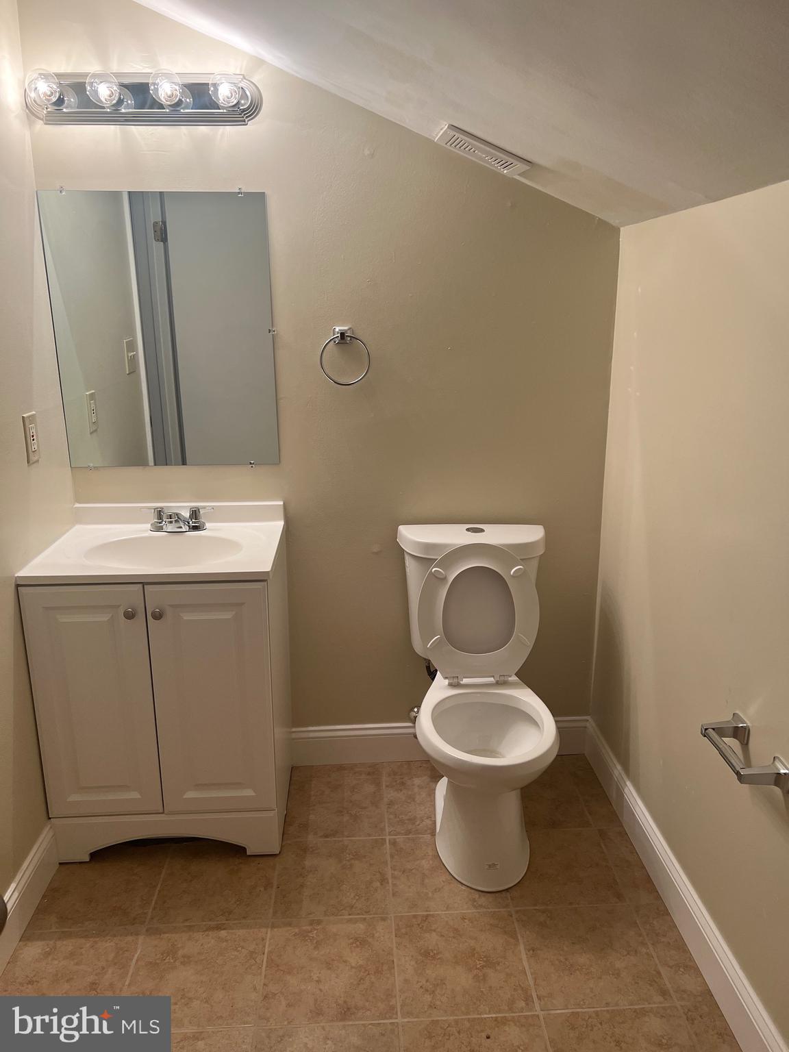 26 Hampton Gate Drive, Unit B Sicklerville, NJ 08081 - Photo 8 of 17 a bathroom with a toilet sink and a mirror