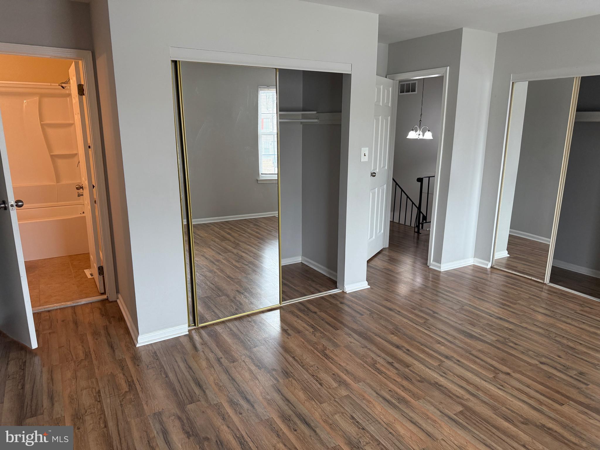 26 Hampton Gate Drive, Unit B Sicklerville, NJ 08081 - Photo 10 of 17 an empty room with wooden floor and entrance