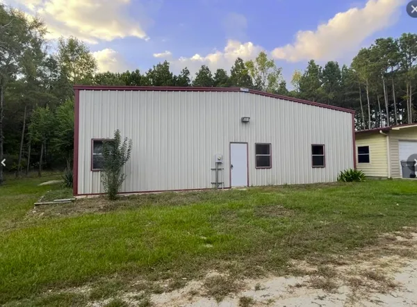 a view of a backyard of the house