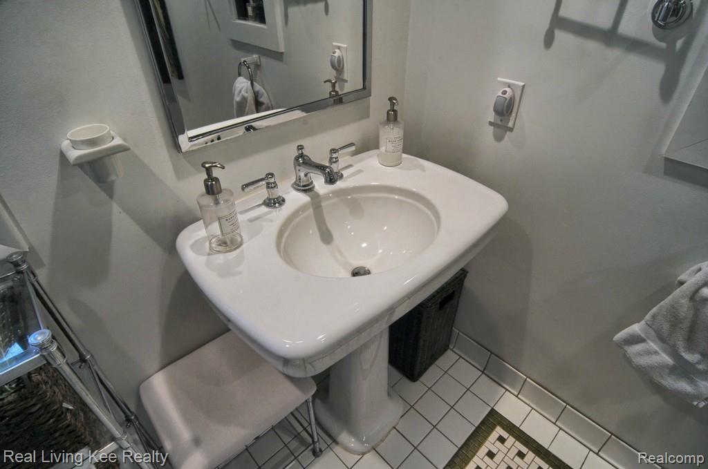 5988 Cobb Creek Road Rochester, MI 48306 - Photo 15 of 27 Master bath sink with a generous amount of space around the basin.