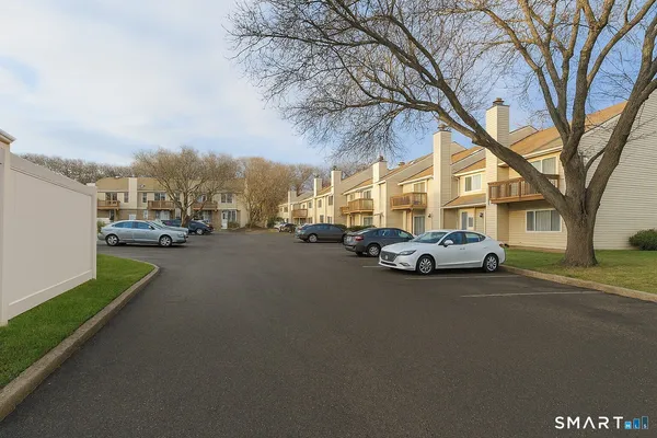 a view of street with parked cars