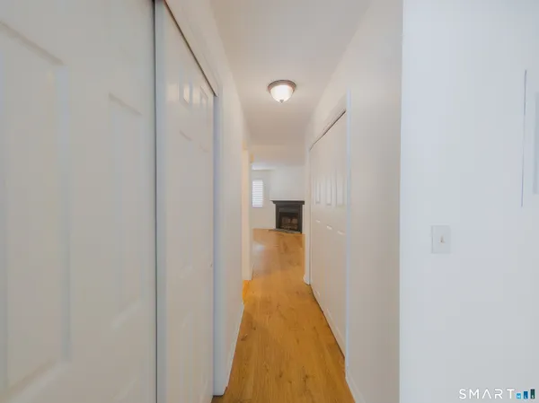a view of a hallway with a white walls