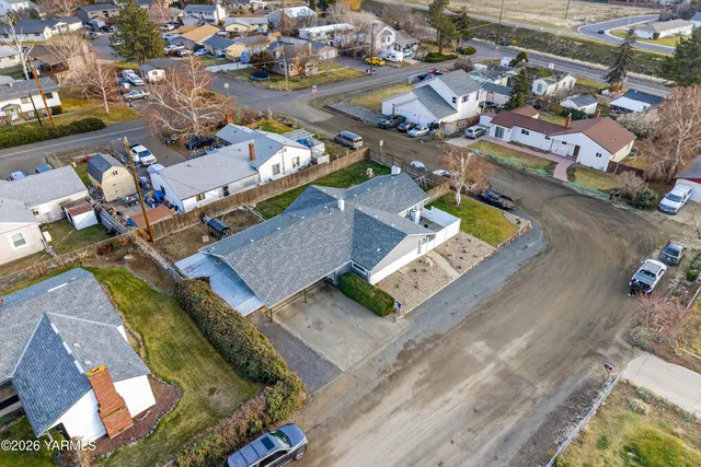 an aerial view of residential houses with outdoor space