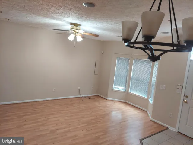 a view of a room with a hardwood