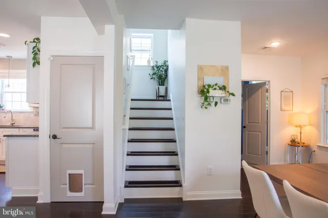 a view of entryway with livingroom and wooden floor