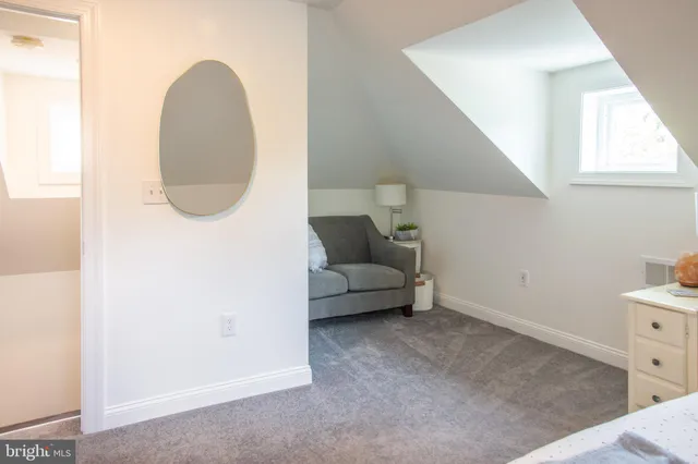 a view of a room with a small space and a window