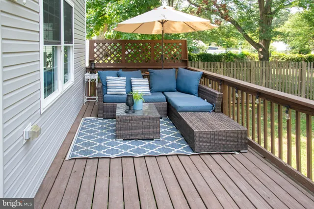 a balcony view with a seating space
