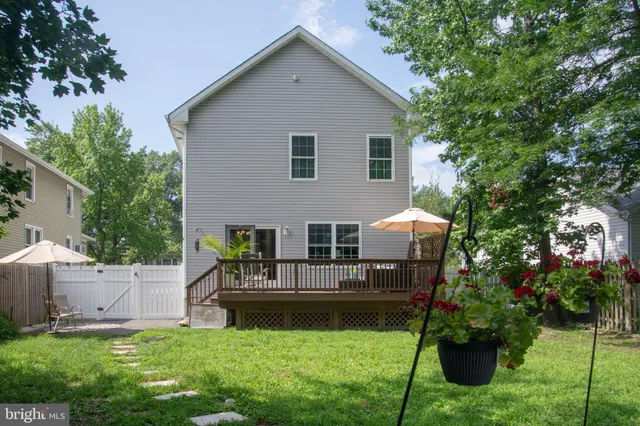 a backyard of a house with yard and outdoor seating