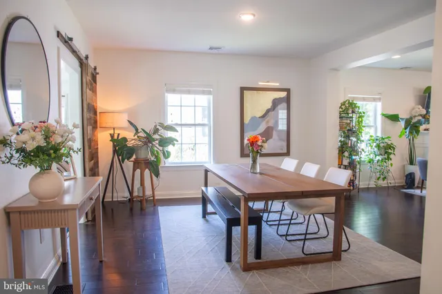 a workspace with furniture window and wooden floor