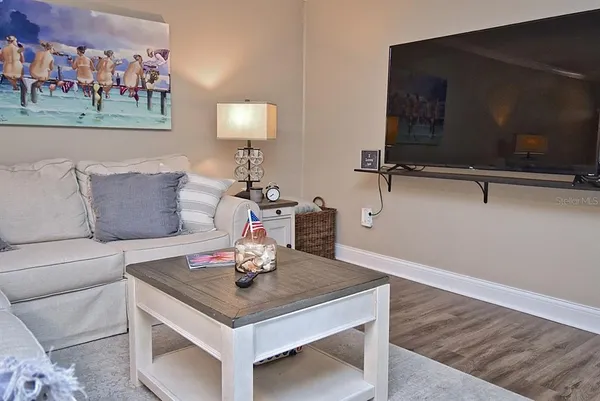a living room with furniture and a lamp