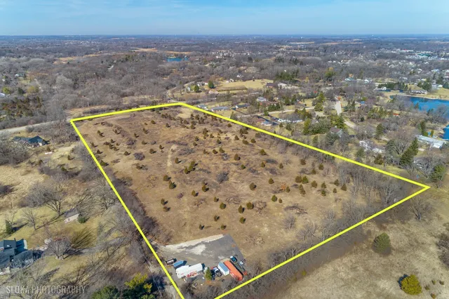 an aerial view of house with yard