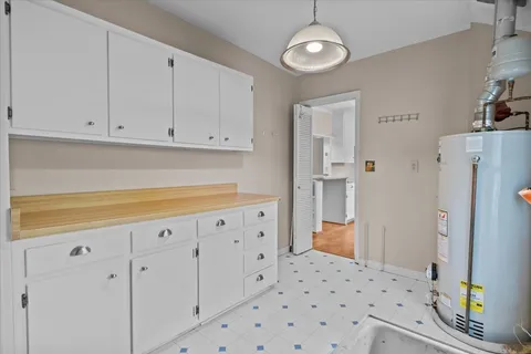 a kitchen with stainless steel appliances a refrigerator and cabinets