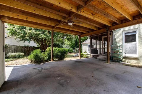 a view of a house with porch and outdoor space