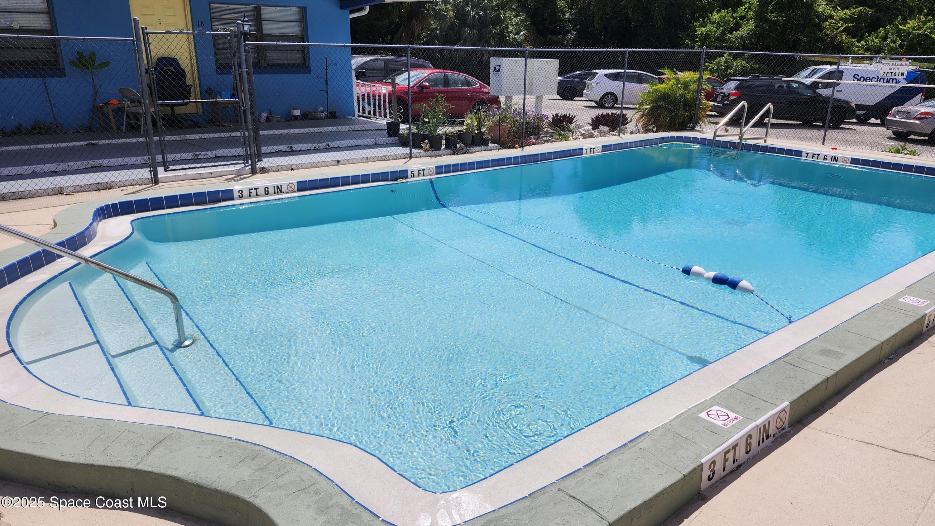 2205 Knox McRae Drive Titusville, FL 32780 - Photo 8 of 9 a view of swimming pool with sitting area