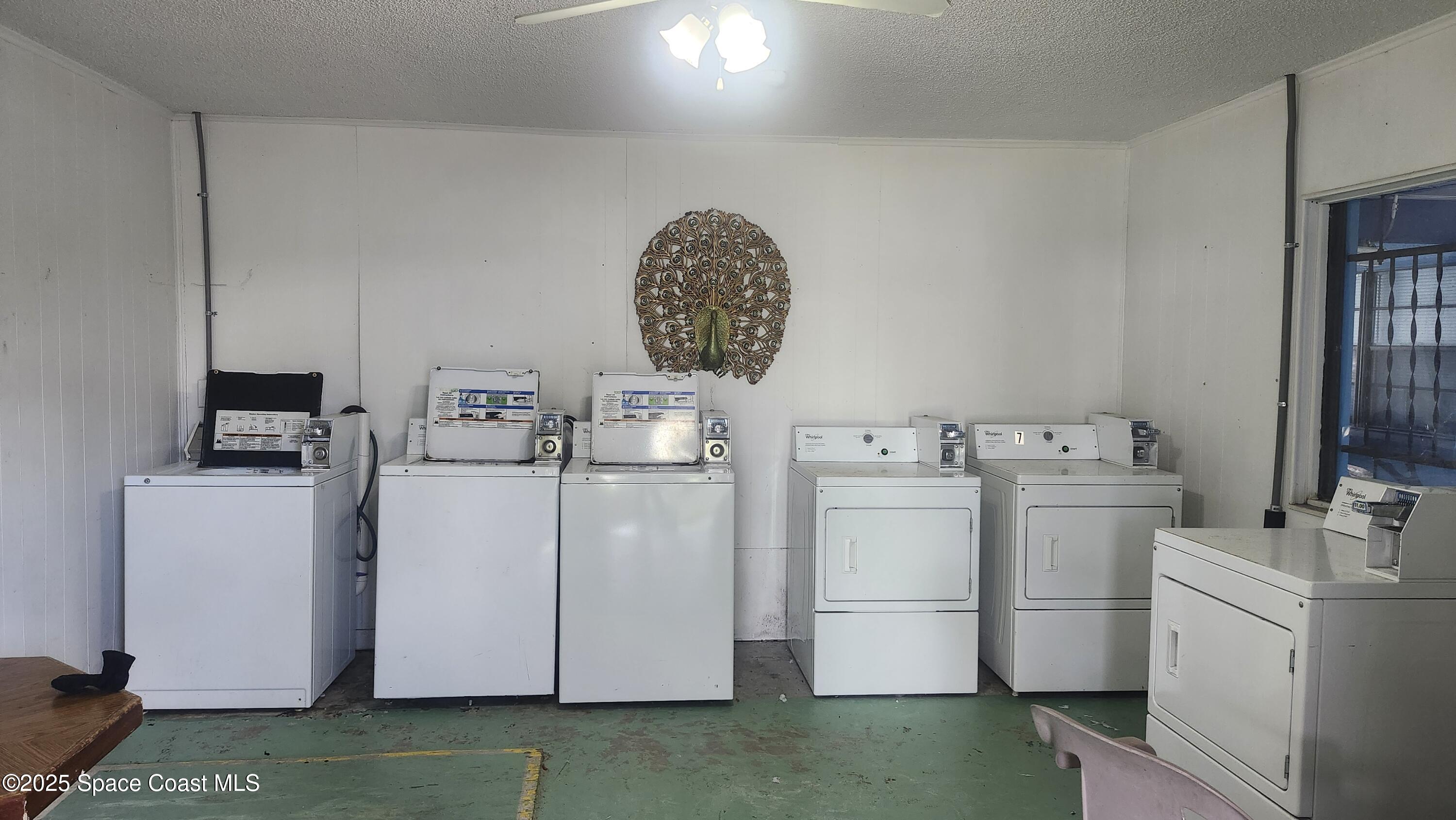 2205 Knox McRae Drive Titusville, FL 32780 - Photo 9 of 9 a room with a storage and utility