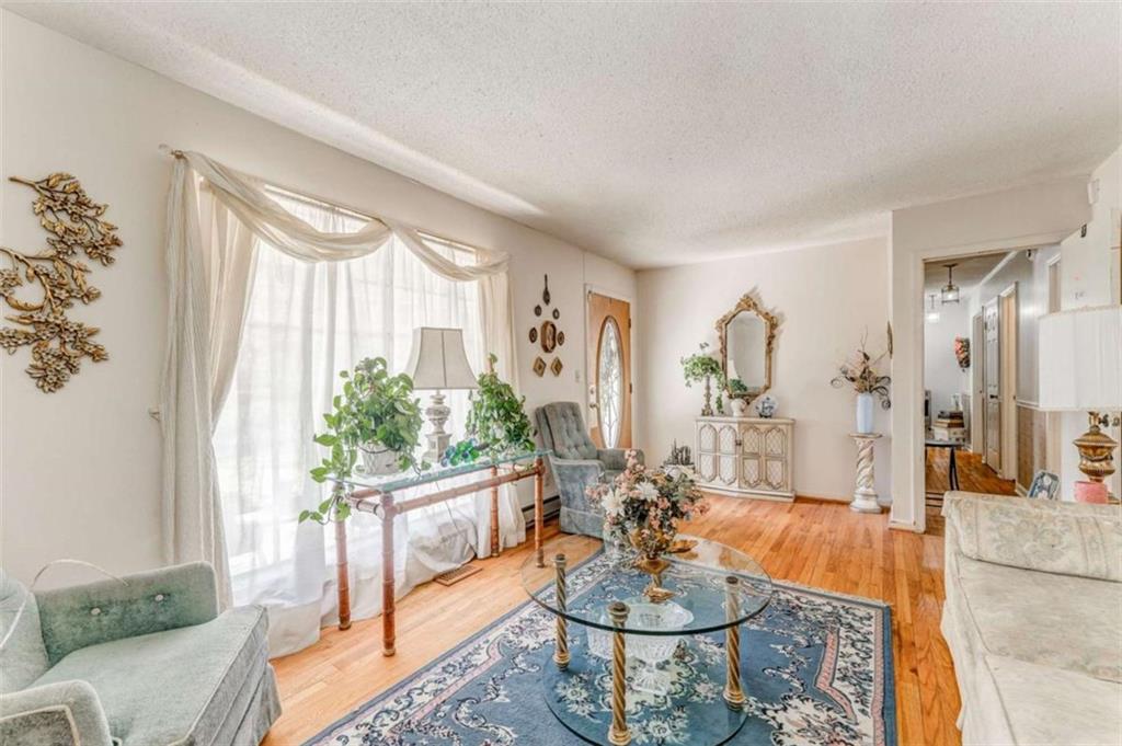 8690 Silver Hill Road Lyerly, GA 30730 - Photo 6 of 35 a living room with furniture and a large window