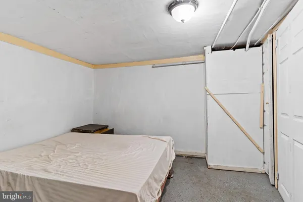 a bedroom with a bed and a table