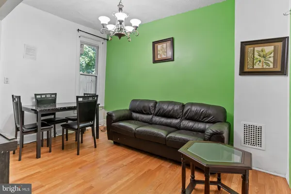 a living room with furniture a table and a window