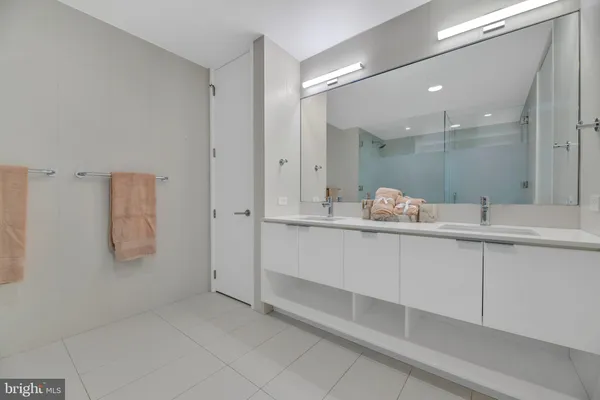 a bathroom with a bathtub and shower