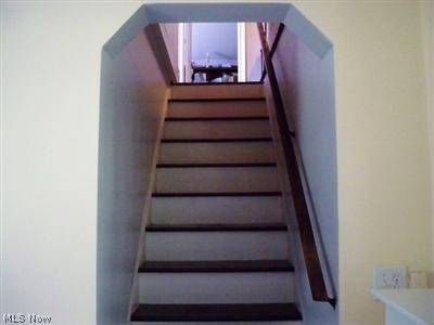5779 Streeter Road Mantua, OH 44255 - Photo 8 of 23 Back wood staircase to the upstairs 2nd floor