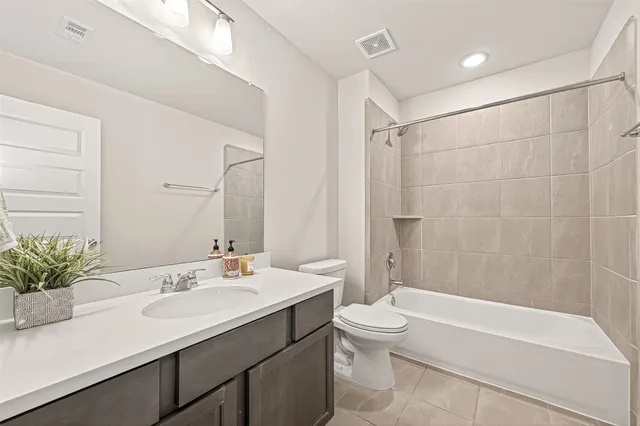 a bathroom with a toilet and shower