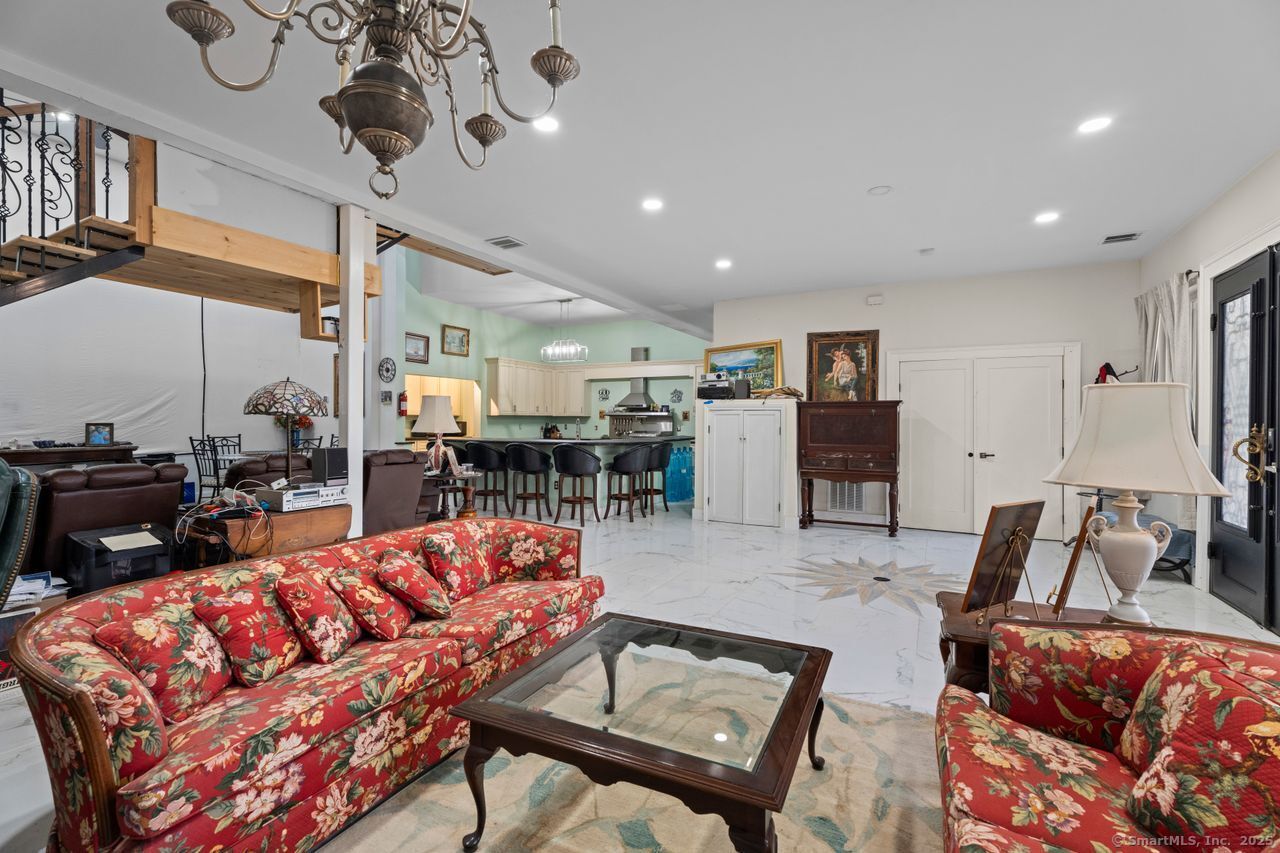 8 Tom Road East Haddam, CT 06423 - Photo 14 of 26 a living room with furniture kitchen view and a chandelier
