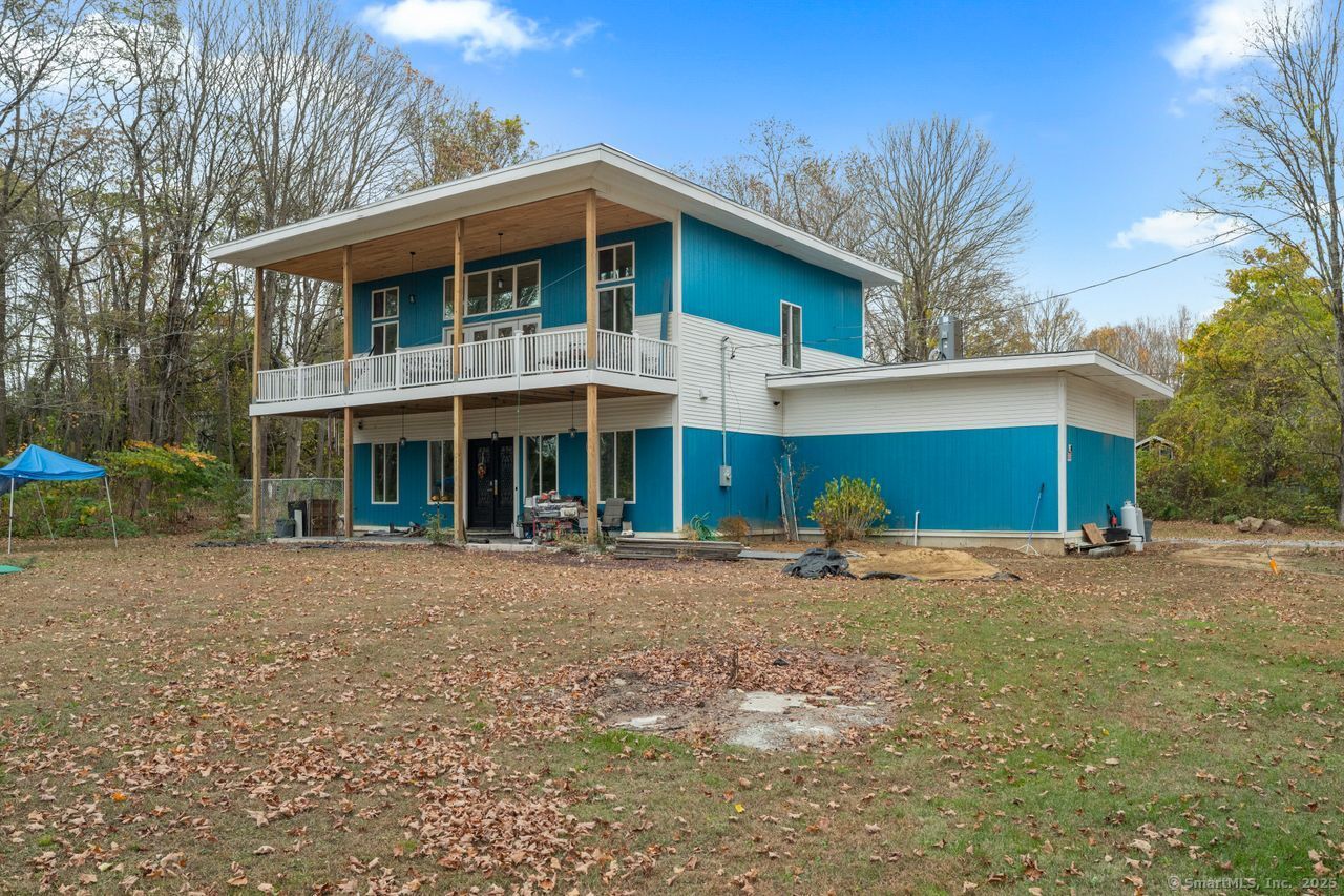 8 Tom Road East Haddam, CT 06423 - Photo 5 of 26 a front view of a house with a yard and trees