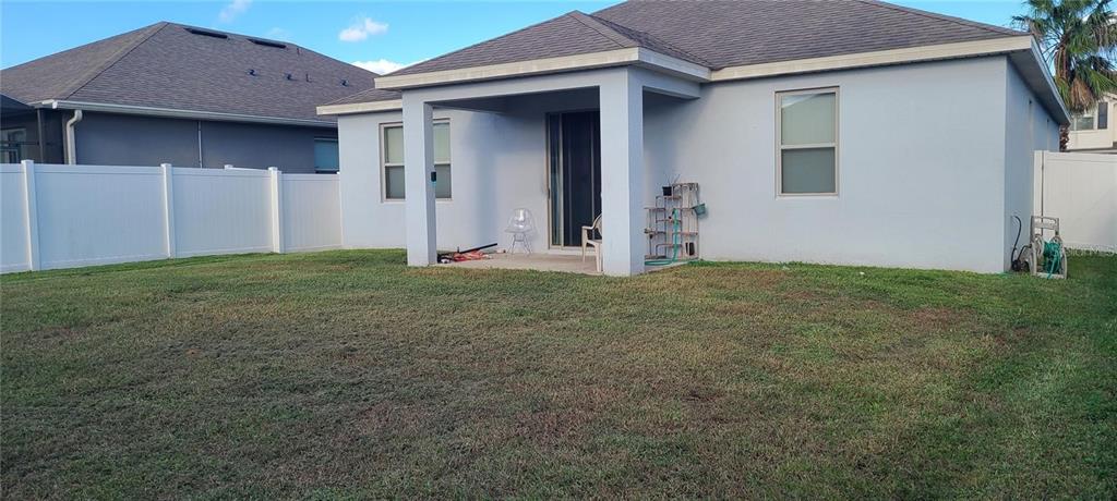 12254 Sandy Apple Road Orlando, FL 32824 - Photo 11 of 14 a view of an house with backyard and space