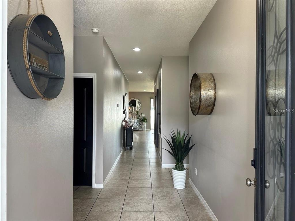 12254 Sandy Apple Road Orlando, FL 32824 - Photo 2 of 14 a view of entryway and hall
