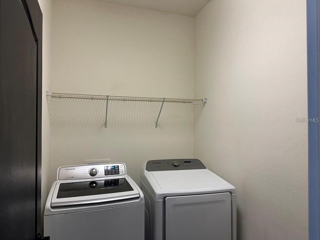 12254 Sandy Apple Road Orlando, FL 32824 - Photo 10 of 14 a room with storage and utility