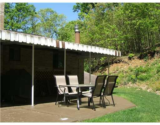 10050 Rinaman Road Wexford, PA 15090 - Photo 16 of 18 Exterior Front. The Rear Patio Provides the Perfect Spot For Entertaining. Easy Access From the Kitchen.