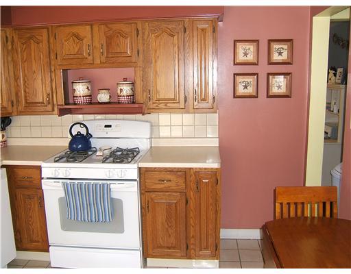10050 Rinaman Road Wexford, PA 15090 - Photo 5 of 18 Kitchen. The Kitchen Features a Ceramic Floor & Backsplash. The Countertops Are a Soft Neutral Tone that Will Accent Any Color Palette.