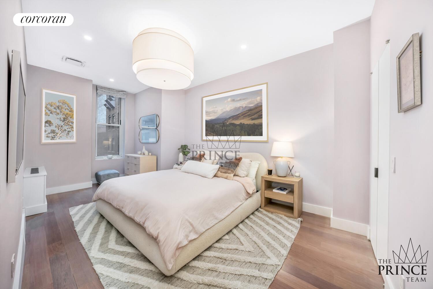 159 Madison Avenue, Unit 10ABC Manhattan, NY 10016 - Photo 13 of 20 a bedroom with a large bed and a chandelier