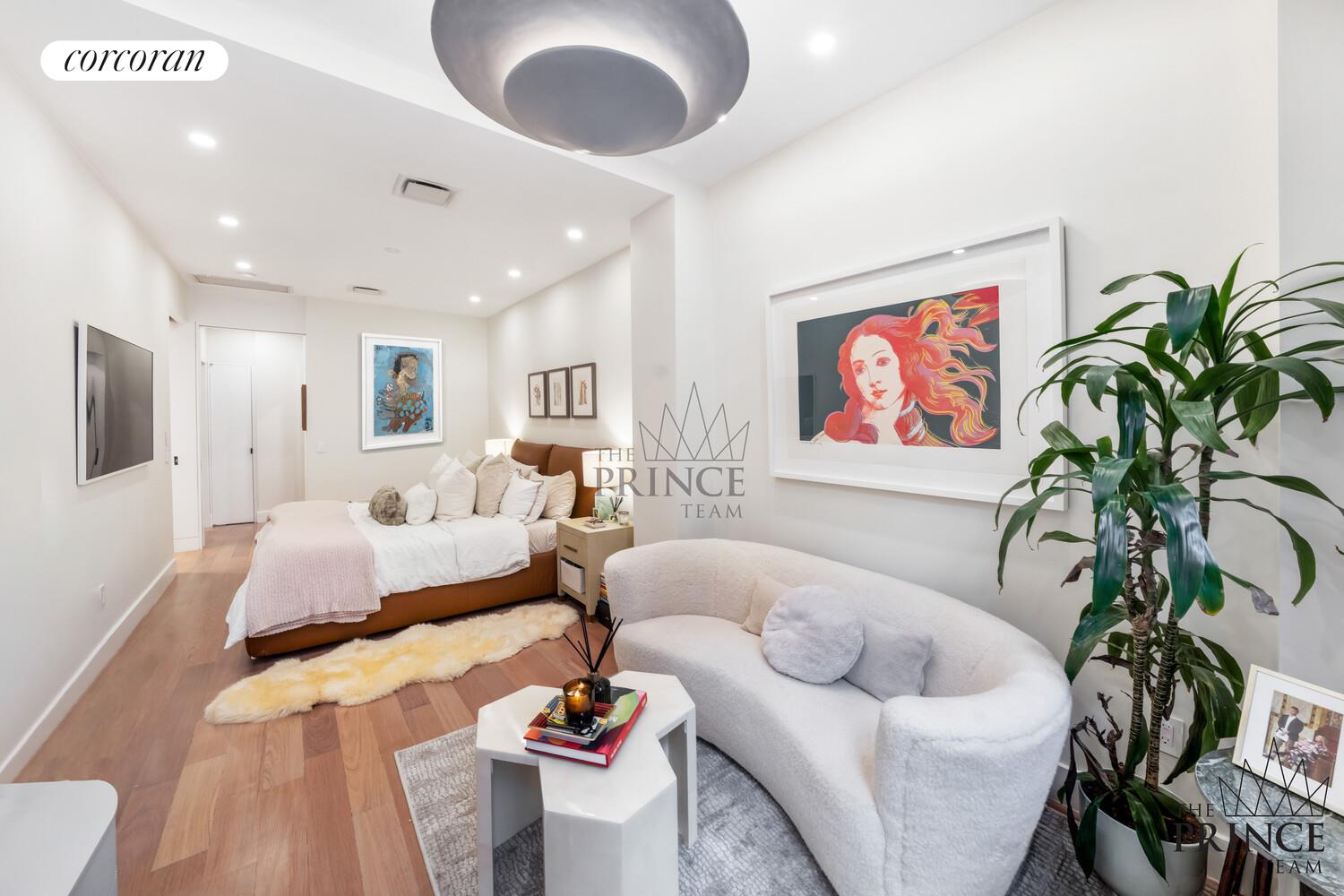 159 Madison Avenue, Unit 10ABC Manhattan, NY 10016 - Photo 9 of 20 a living room with furniture potted plant and a flat screen tv