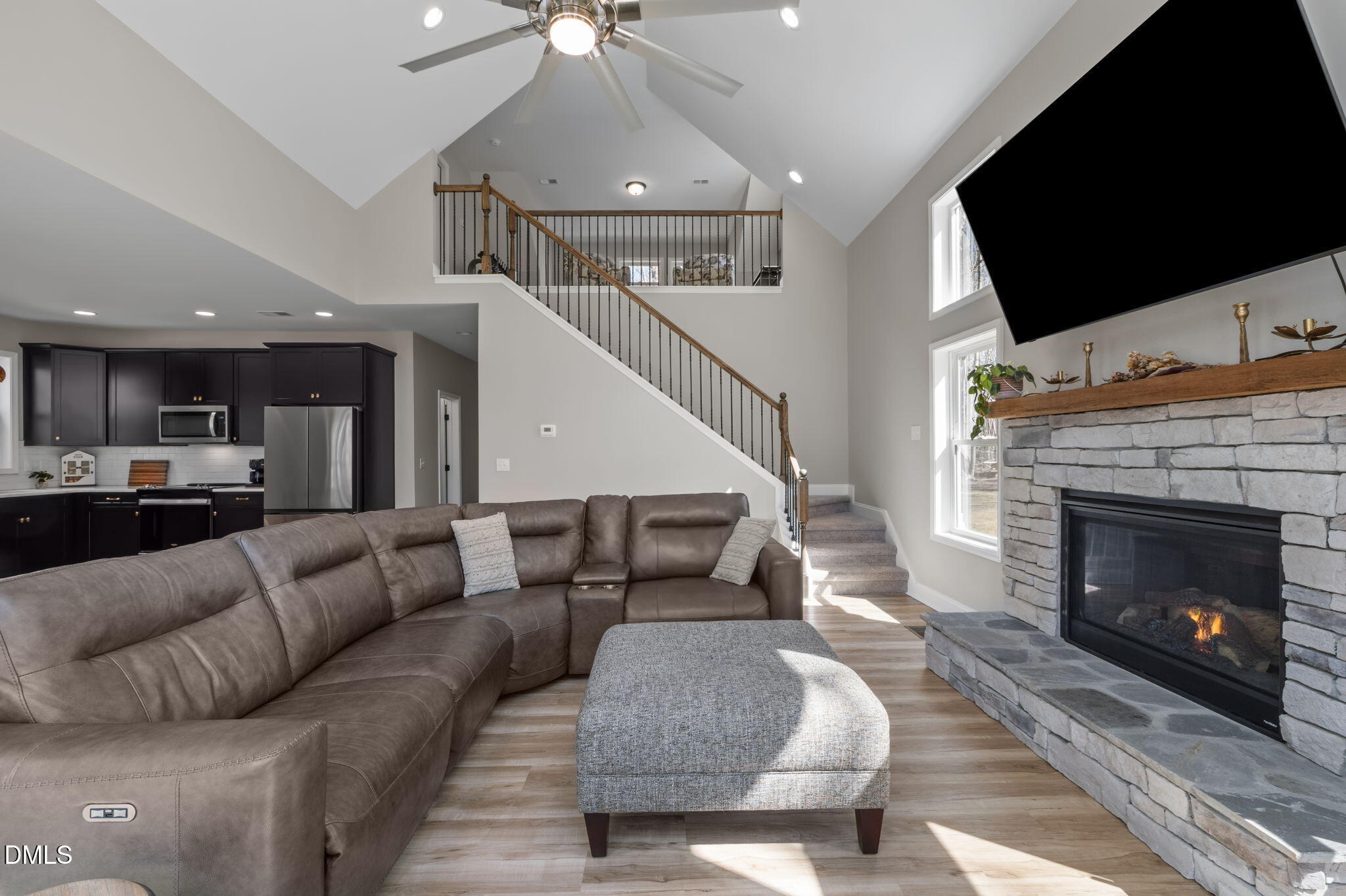 8514 Charlie Stovall Road Roxboro, NC 27574 - Photo 18 of 48 a living room with furniture and a fireplace