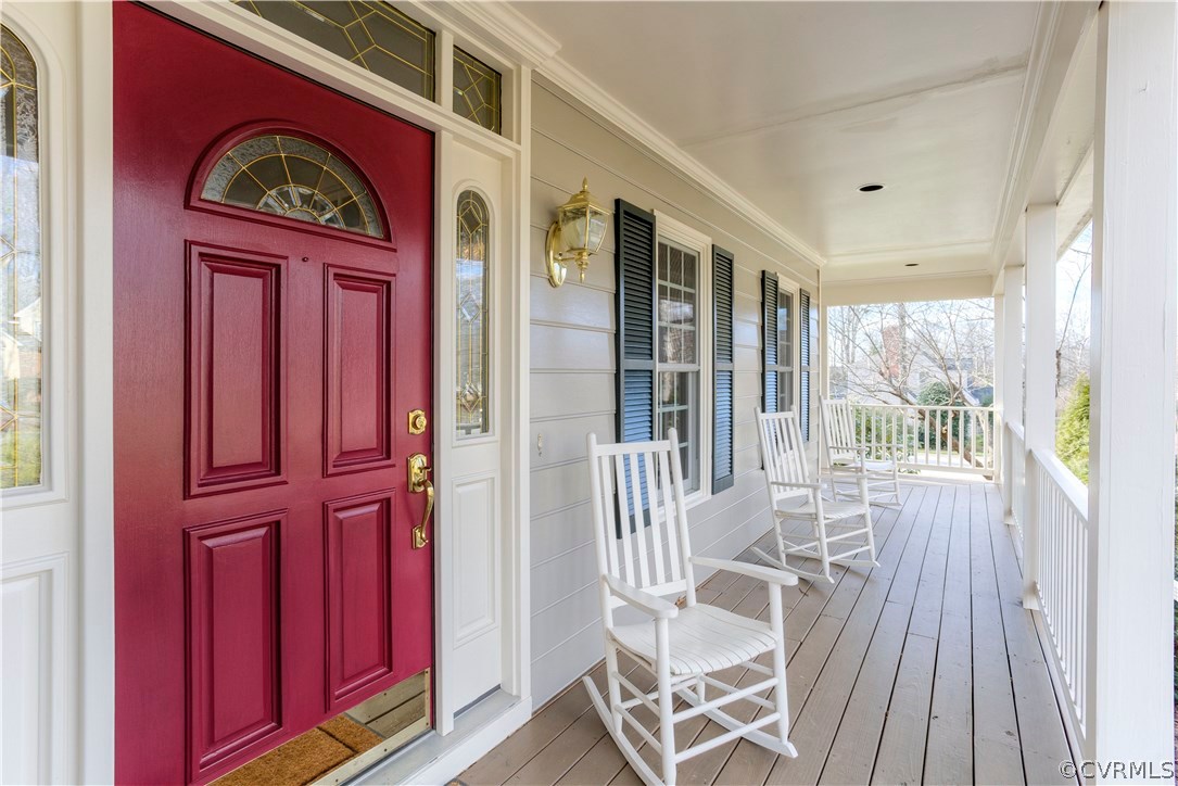 14411 Newgate Road Midlothian, VA 23113 - Photo 4 of 38 a view of a balcony with furniture and wooden floor