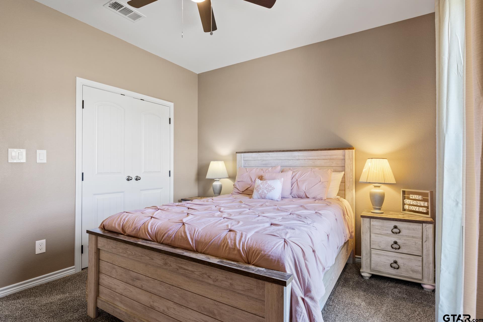 25 Private Road Pittsburg, TX 75686 - Photo 14 of 29 a bedroom with a bed and a cabinets