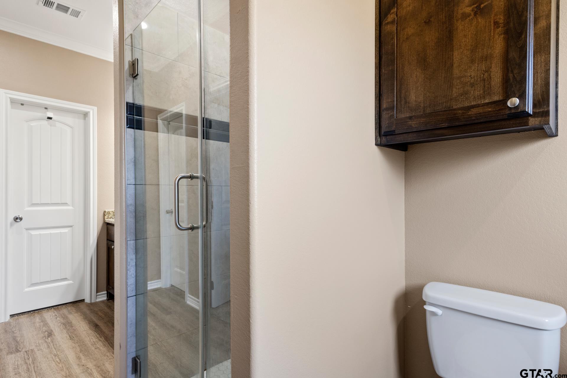 25 Private Road Pittsburg, TX 75686 - Photo 22 of 29 a bathroom with a toilet sink and shower