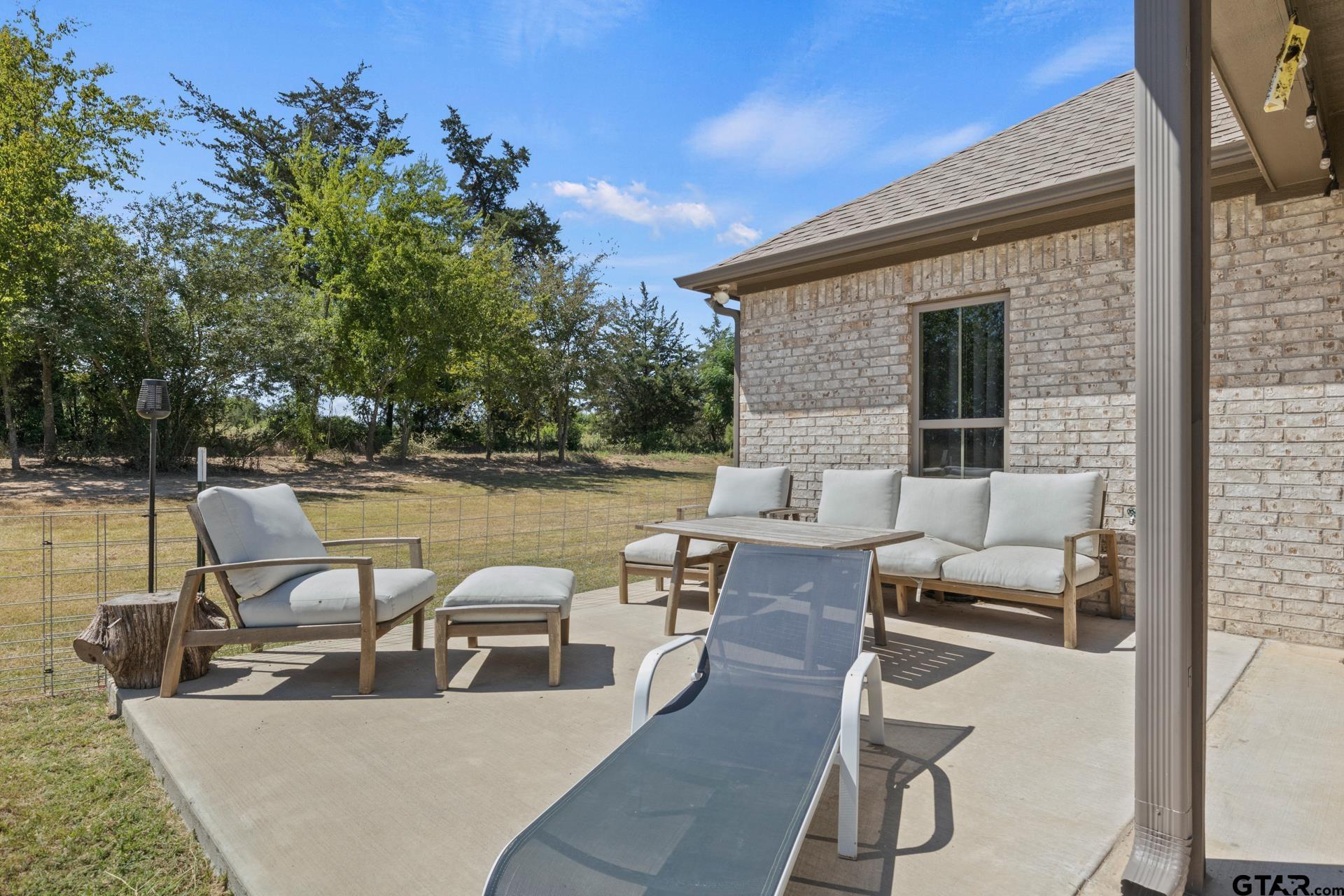 25 Private Road Pittsburg, TX 75686 - Photo 25 of 29 swimming pool with outdoor seating and plants