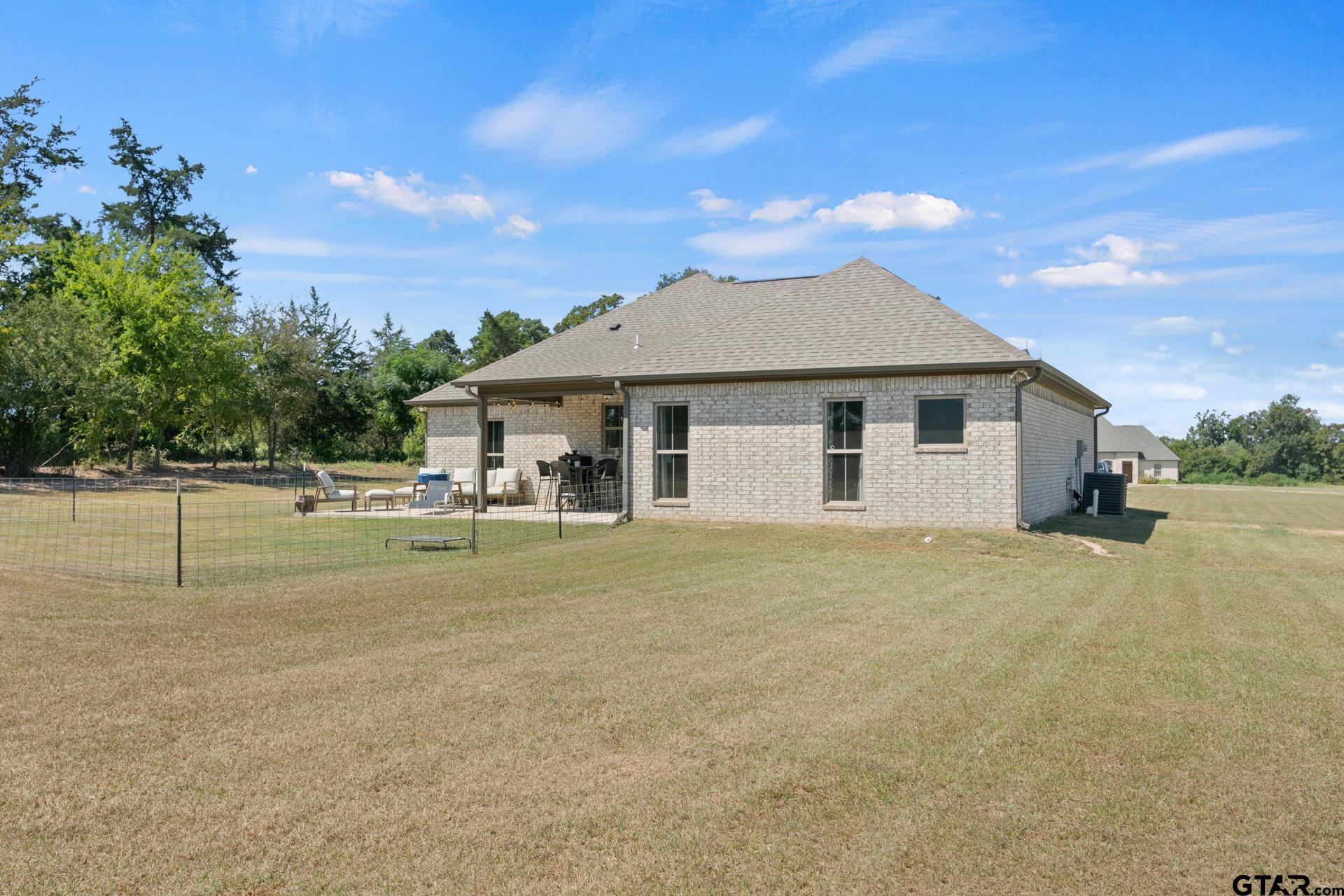 25 Private Road Pittsburg, TX 75686 - Photo 29 of 29 a front view of a house with a garden