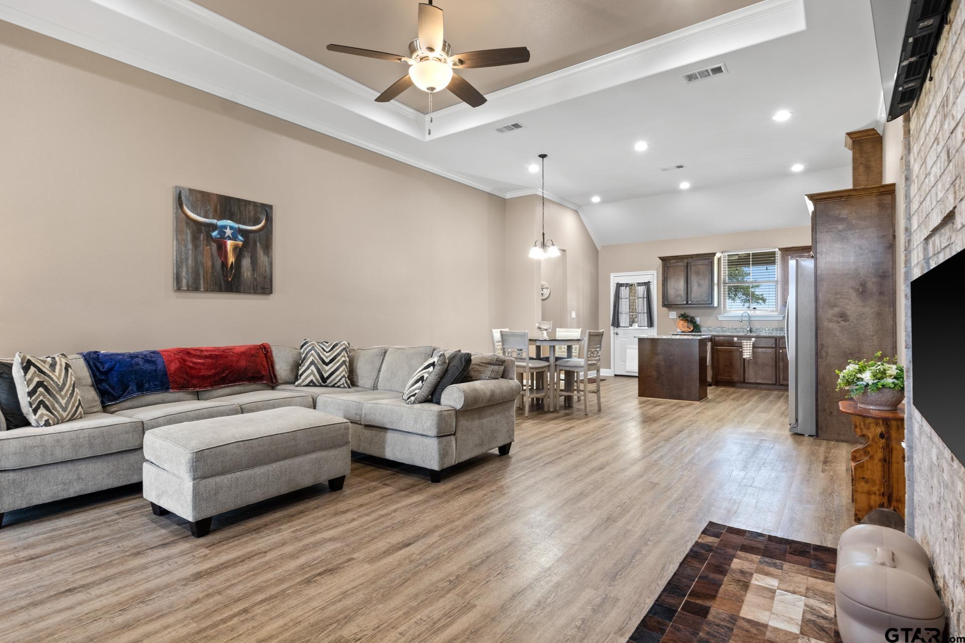 25 Private Road Pittsburg, TX 75686 - Photo 4 of 29 a living room with furniture and a wooden floor