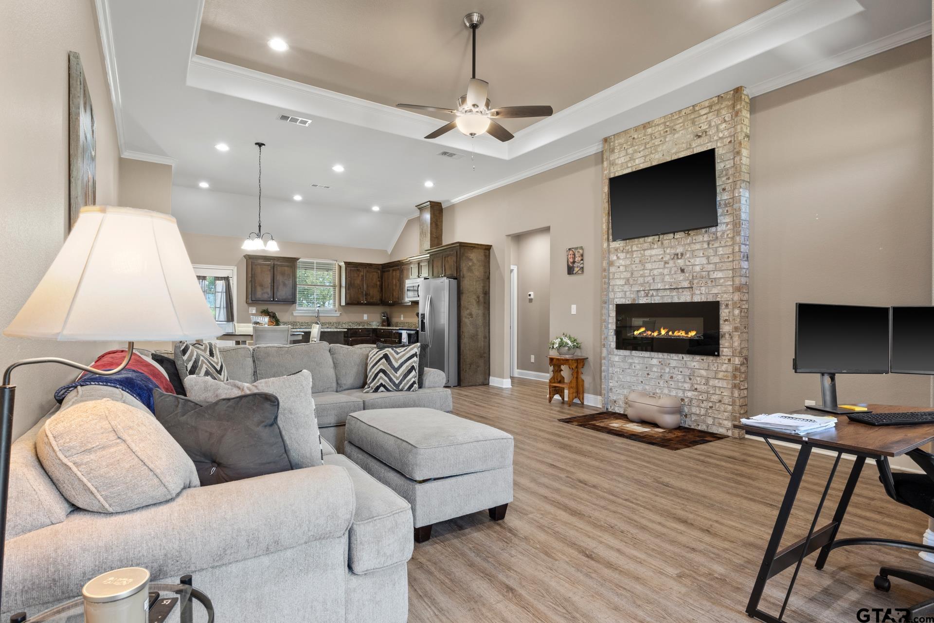 25 Private Road Pittsburg, TX 75686 - Photo 5 of 29 a living room with furniture and a fireplace